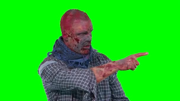 Scary zombie points at upper right corner finger — Stock Video