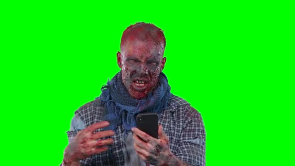 Scary zombie in halloween isolated green background — Stock Video