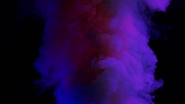 Violet and pink bomb smoke on black background