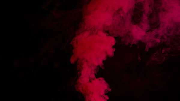 Red bomb smoke on black background