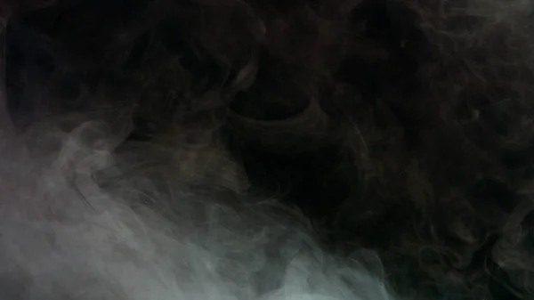 Kleurrijke rook op donkere achtergrond — Stockfoto