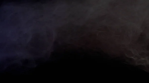 Πολύχρωμος καπνός σε σκούρο φόντο — Φωτογραφία Αρχείου
