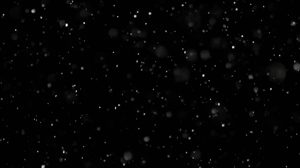 Neige blanche tombant sur fond noir isolé — Photo