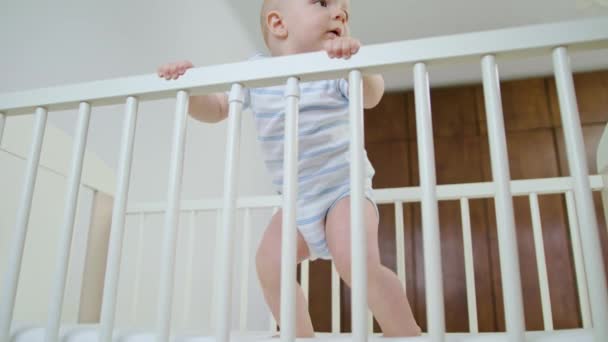 Cute Baby Playing in her Crib at Home — Stock Video