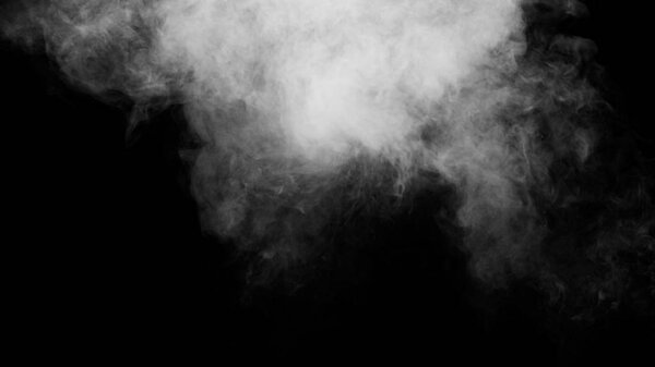 White clouds of vapor smoke are isolated on a black background. Gas explodes, swirl and dances in space. A magic fog dust texture effect that can be used by overlay and changing their transparency.