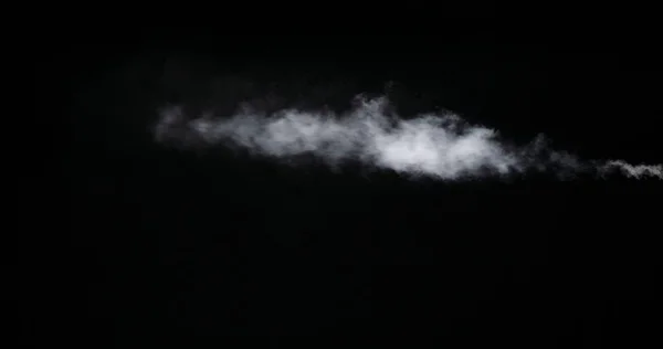 Huella de humo blanca aislada sobre fondo negro — Foto de Stock