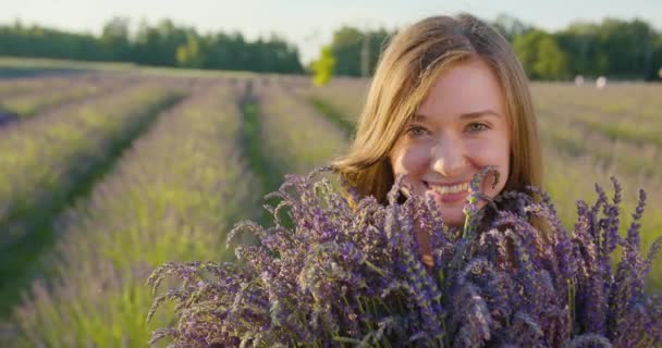 Young Lady in the Fielf of Blue Flowers — Stock Video