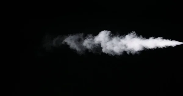 Huella de humo blanca aislada sobre fondo negro —  Fotos de Stock