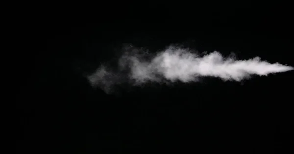 Huella de humo blanca aislada sobre fondo negro —  Fotos de Stock