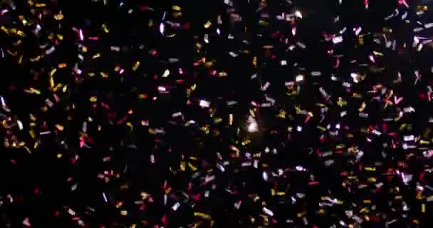 Confetti ізольовані на чорному тлі — стокове відео