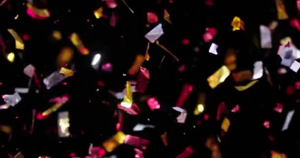 Confetti geïsoleerd op zwarte achtergrond — Stockvideo