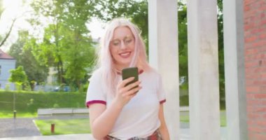 Beatiful Lady Using a Phone Outdoors