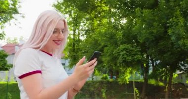 Beatiful Lady Using a Phone Outdoors