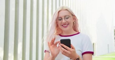 Beatiful Lady Using a Phone Outdoors