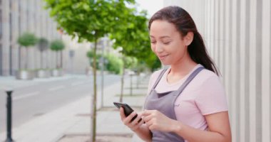 Beatiful Lady Using a Phone Outdoors