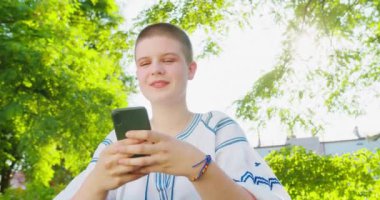 Beatiful Lady Using a Phone Outdoors