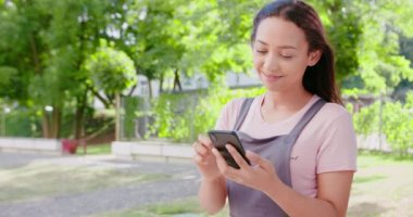 Beatiful Lady Using a Phone Outdoors