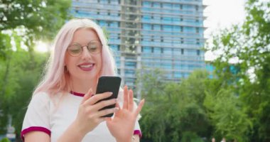 Beatiful Lady Using a Phone Outdoors