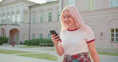 Beatiful Lady Using a Phone Outdoors