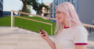 Beatiful Lady Using a Phone Outdoors