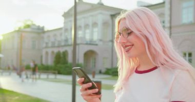 Beatiful Lady Using a Phone Outdoors