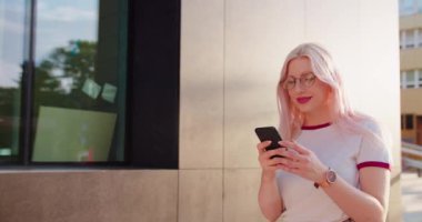 Beatiful Lady Using a Phone Outdoors