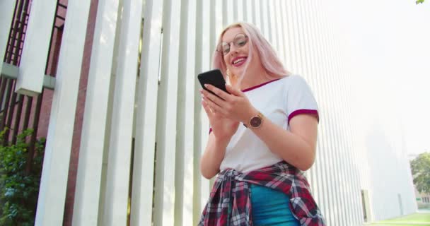 Beatiful Lady Using a Phone Outdoors — 图库视频影像