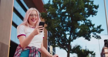 Beatiful Lady Using a Phone Outdoors