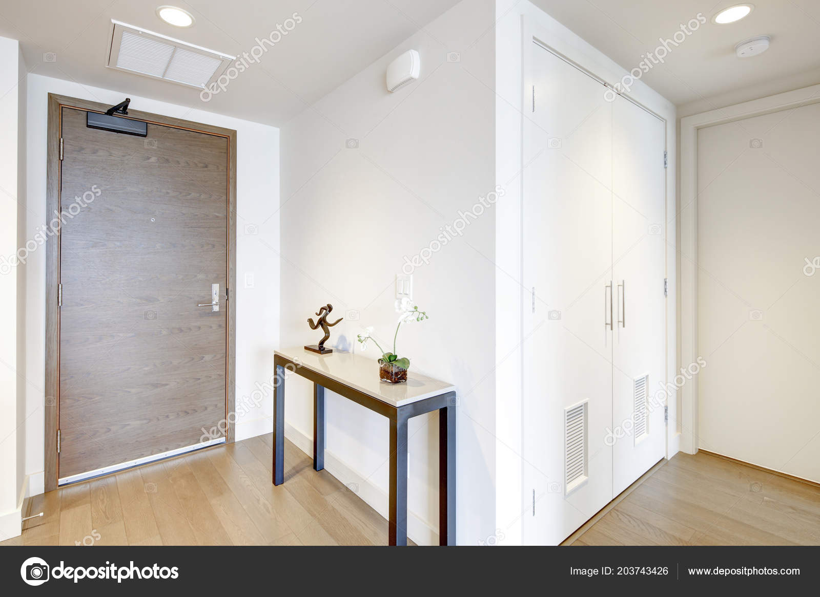 table for entrance hall luxury white condo entrance hall features console table atop light brown stock photo table for entrance hall luxury white condo entrance hall features console table atop light brown stock photo