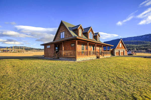 Beautiful ranch style home exterior on a bright sunny day with blue sky. Northwest, USA.