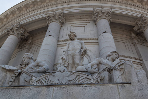 MADISON, WISCONSIN - May 10, 2014: Statues created by Karl Bitter adorn the exterior of the capital building  in Madison, WI on May 10, 2014.