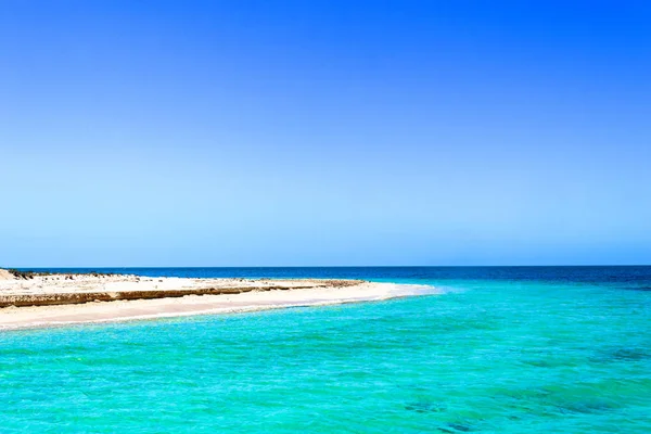 Cuba\'s hidden beauty in nature. The blue sea and sky surrounding the fishermen town of Tunas de Zaza. Arriving to White Key (Cayo Blanco) which is and inhabited and pristine key four (4)  kilometres away from the shore.