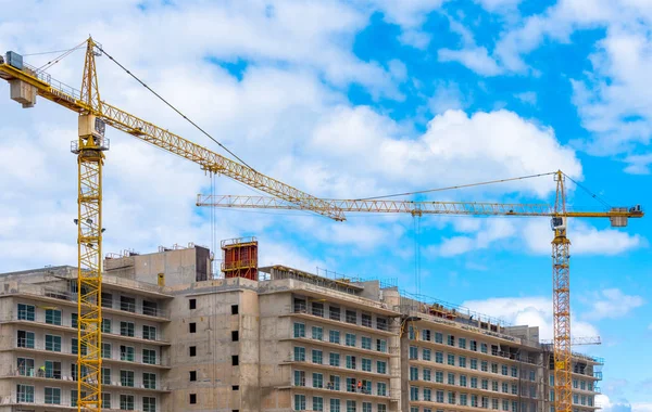 The new 'International Hotel'. Working cranes at a construction site building brand new hotel.