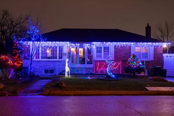 Toronto, Canada-December 15, 2018: Residential houses illuminated with vibrant color Christmas lights. Recently, Canada was selected among the best countries to celebrate Christmas.