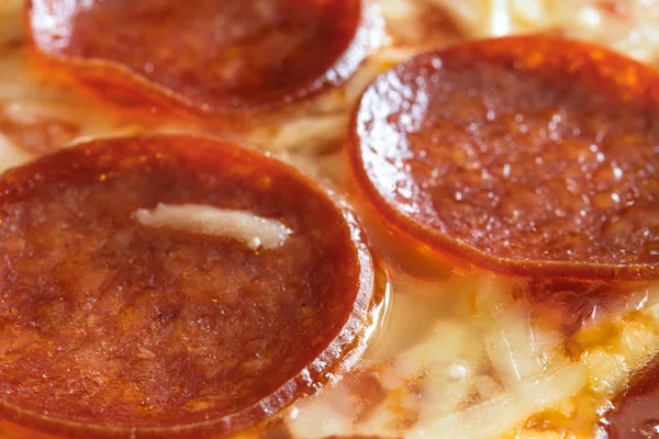 Extreme close-up of a pepperoni pizza