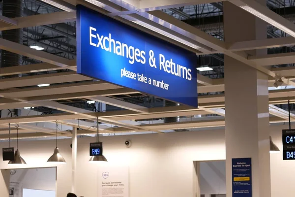 Close up exchanges and returns sign inside Ikea store — Stock Photo, Image