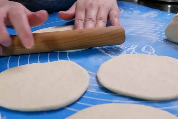 Motion of people kneading the dough and shaping it with their hands to steam bun at home — Stock Photo, Image