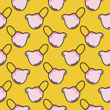 Pembe maske, sarı arkaplanda pürüzsüz desen..