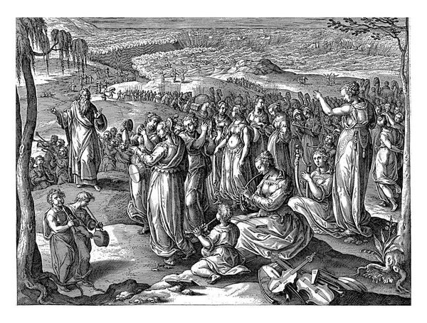 After the safe passage through the Red Sea, the Israelites say a song of thanks. Moses is on the left, vintage engraving.