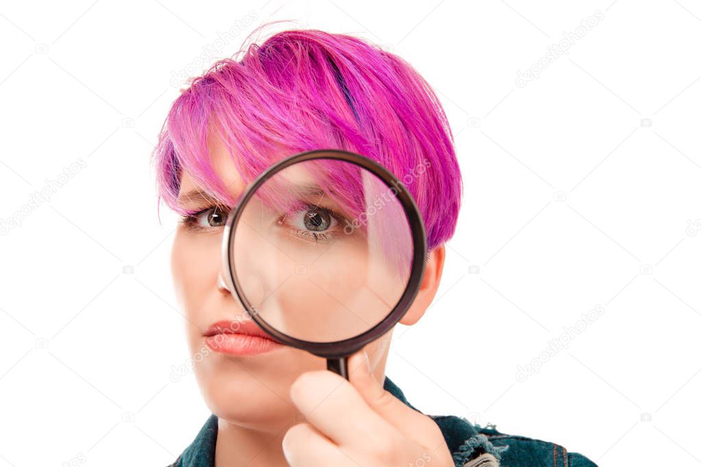 Investigator. Meticulous detective curious business analyst concept. Closeup macro face expressive curious girl looking through magnifying glass isolated on white background. Skeptical about situation