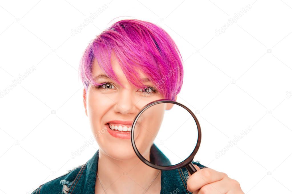 Good skin solve face problem concept. Closeup cropped Portrait of a young happy woman showing skin through magnifying lens at big large pores skin isolated white background. Horizontal image in studio