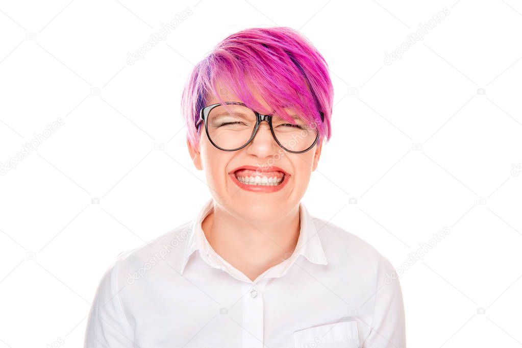 Squint eyed woman with weird expression isolated on white. Woman with crazy face eyes almost closed disgusted by what she sees isolated white background. Negative facial expression human face emotion.