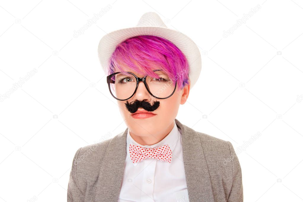 Beautiful, pretty young woman imitating upset suspicious frustrated man. Attractive girl with fake mustache under nose imitating moustache posing on white background Negative emotion face expression.
