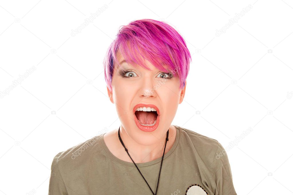 Angry young woman shocked screaming isolated on white background. Studio shot horizontal image. Millennial model with pink magenta hair. Stunned, surprised, wow, omg, no way concept.