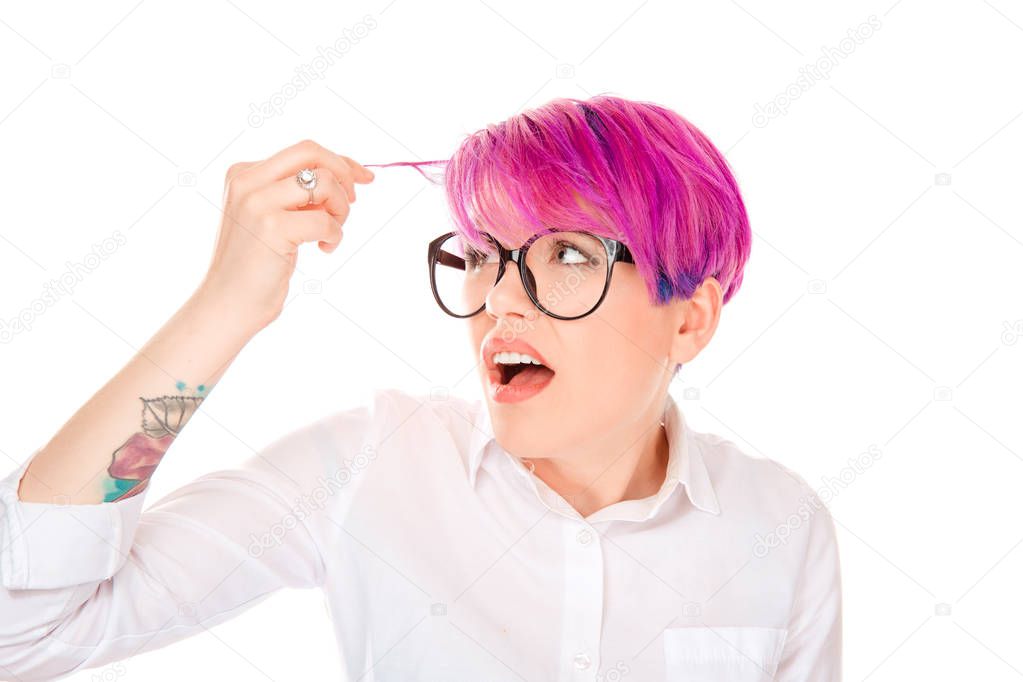 Closeup portrait, annoyed woman looking worried at her pink magenta color hair or balding, isolated on white background. Negative human emotion facial expression feelings attitudes reaction situation.