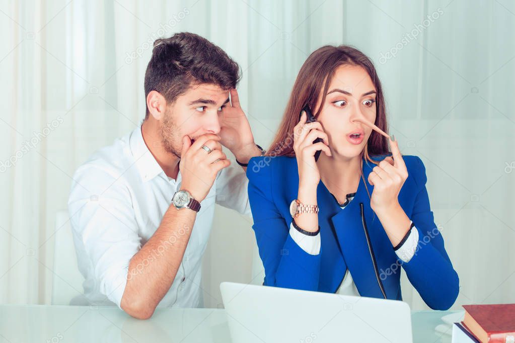 Young nosy man eavesdropping on young woman telling lies while speaking on phone, girl surprised by long nose growing longer in the office at workplace, home at the table . Liar concept and grapevine