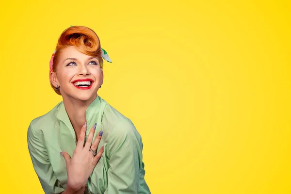 Closeup red head young excited woman pretty pinup girl green button shirt smiling laughing looking up isolated on yellow background retro vintage 50\'s style. Human emotions body language positive face
