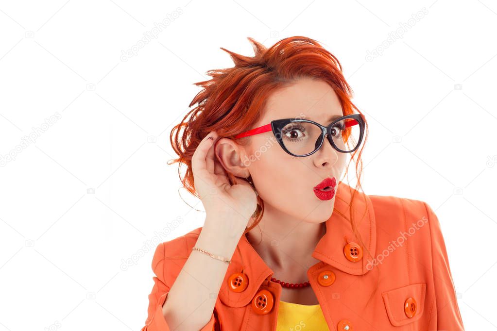 Closeup portrait surprised young nosy woman hand to ear gesture carefully intently secretly listening juicy gossip conversation news privacy violation isolated white background. Human face expression