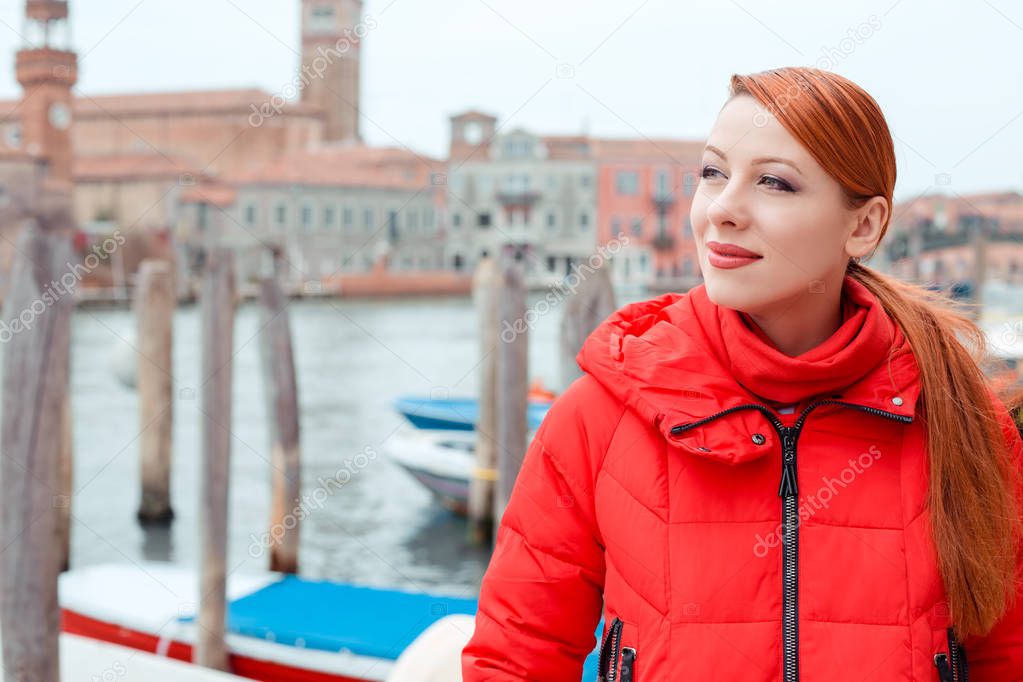 Dreamy young woman traveler in Venice