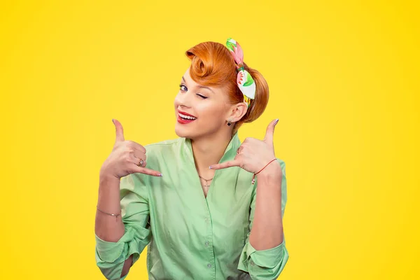 Young woman making showing call me sign winking — Stockfoto